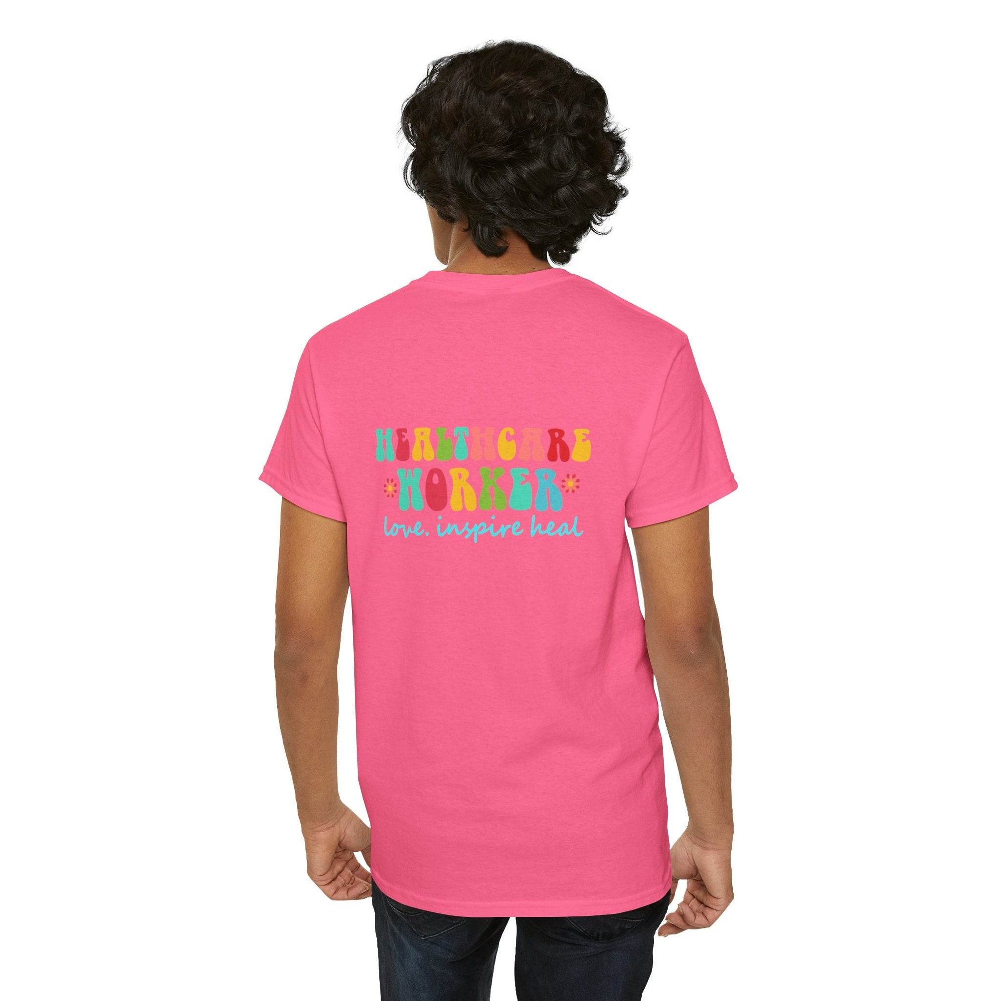 Pink healthcare workers T-shirt with colorful back graphic; person shown from behind.
