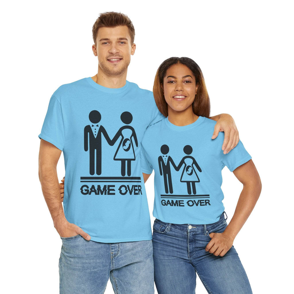 Couple wearing blue Game Over wedding and pregnancy reveal T‑shirts with stick-figure family and baby icon.