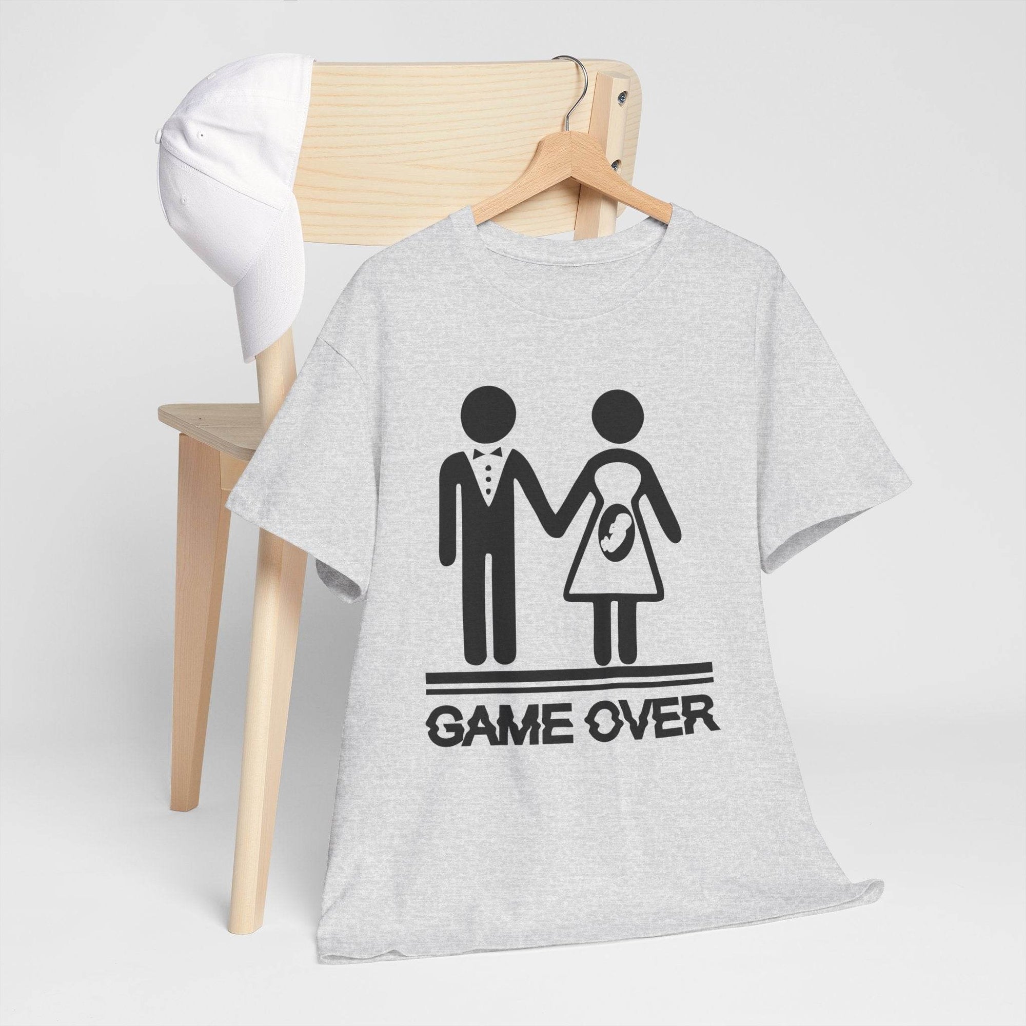 Game Over wedding/pregnancy reveal tee: stick-figure couple with baby icon and bold GAME OVER.