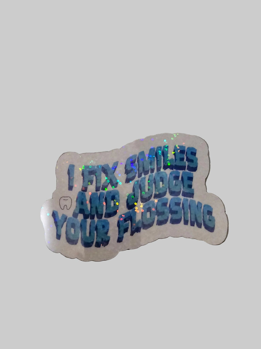 Holographic sticker with text on a grid surface