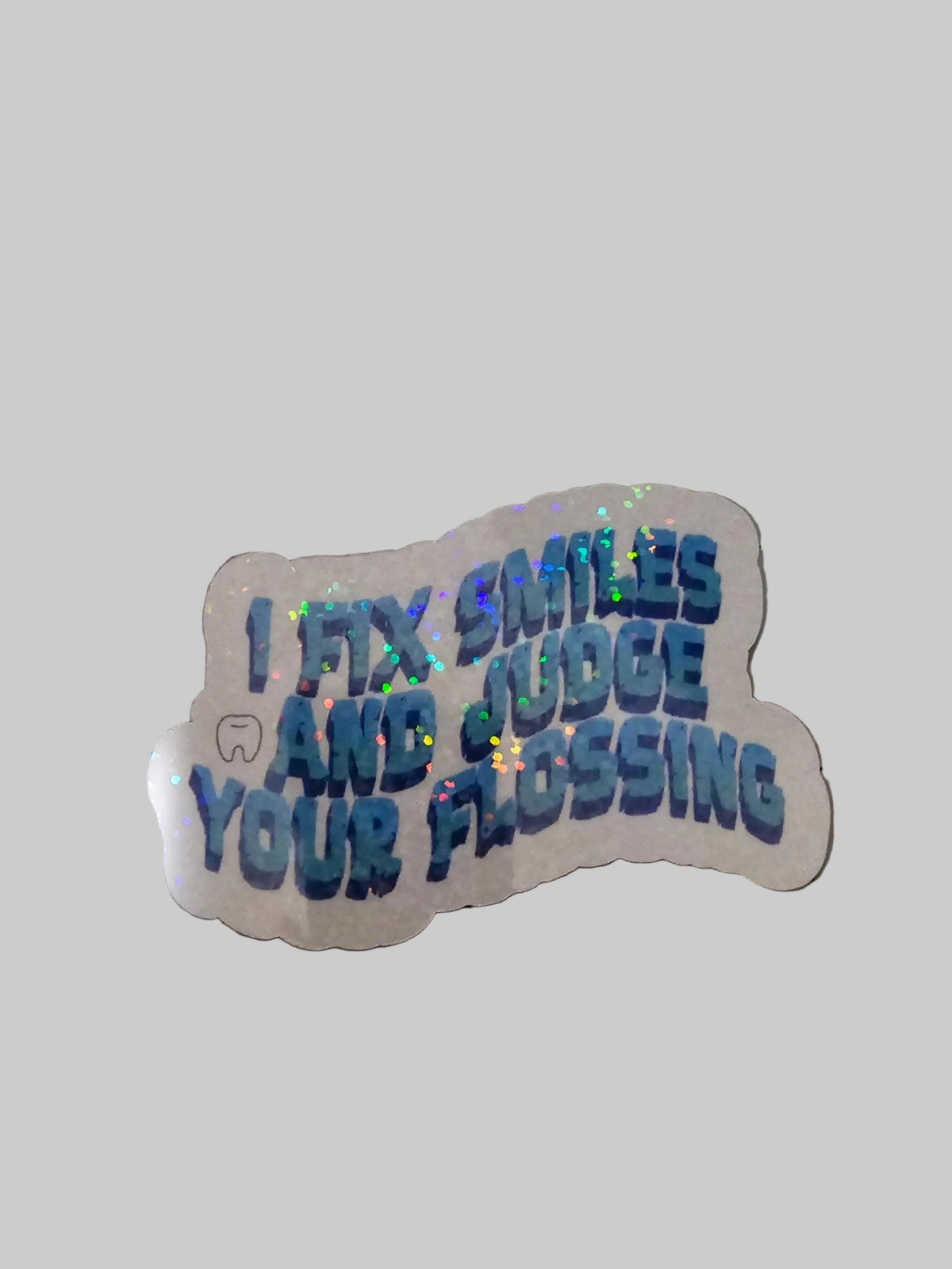 Holographic sticker with text on a grid surface