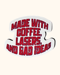 White mask with red text 'MADE WITH COFFEE, LASERS, AND BAD IDEAS' on a white background