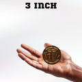 Hand holding a circular wooden sign with text and tool illustrations, labeled '3 Inch'.
