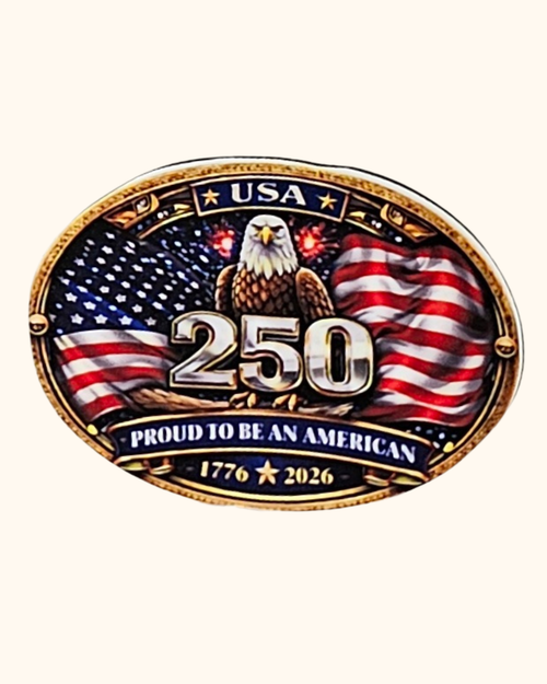 Belt buckle with American flag, eagle, and 'Proud to be an American' text on a white background