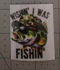 Fish wearing sunglasses and a hat with text 'Wishin' I Was Fishin'' on a white background
