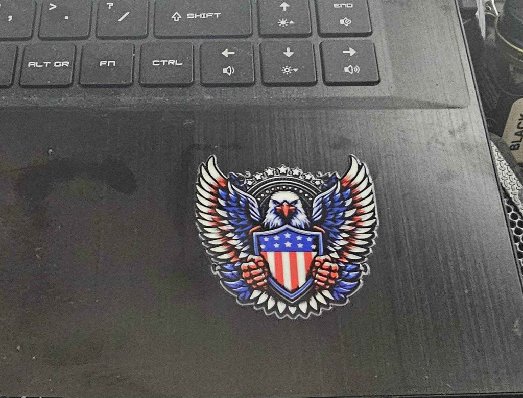 Decorative emblem with an eagle and American flag on a laptop
