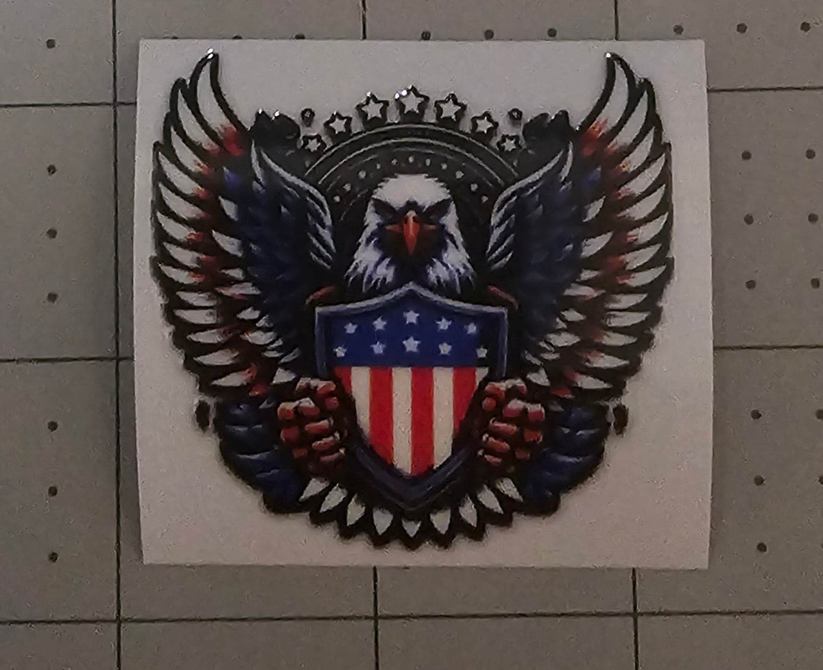 Eagle emblem with American flag design on a white background