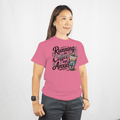 Person wearing a pink t-shirt with text and a coffee cup graphic on a white background