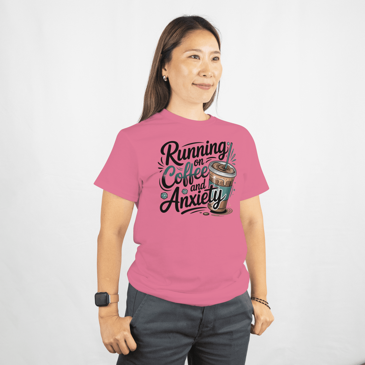 Person wearing a pink t-shirt with text and a coffee cup graphic on a white background
