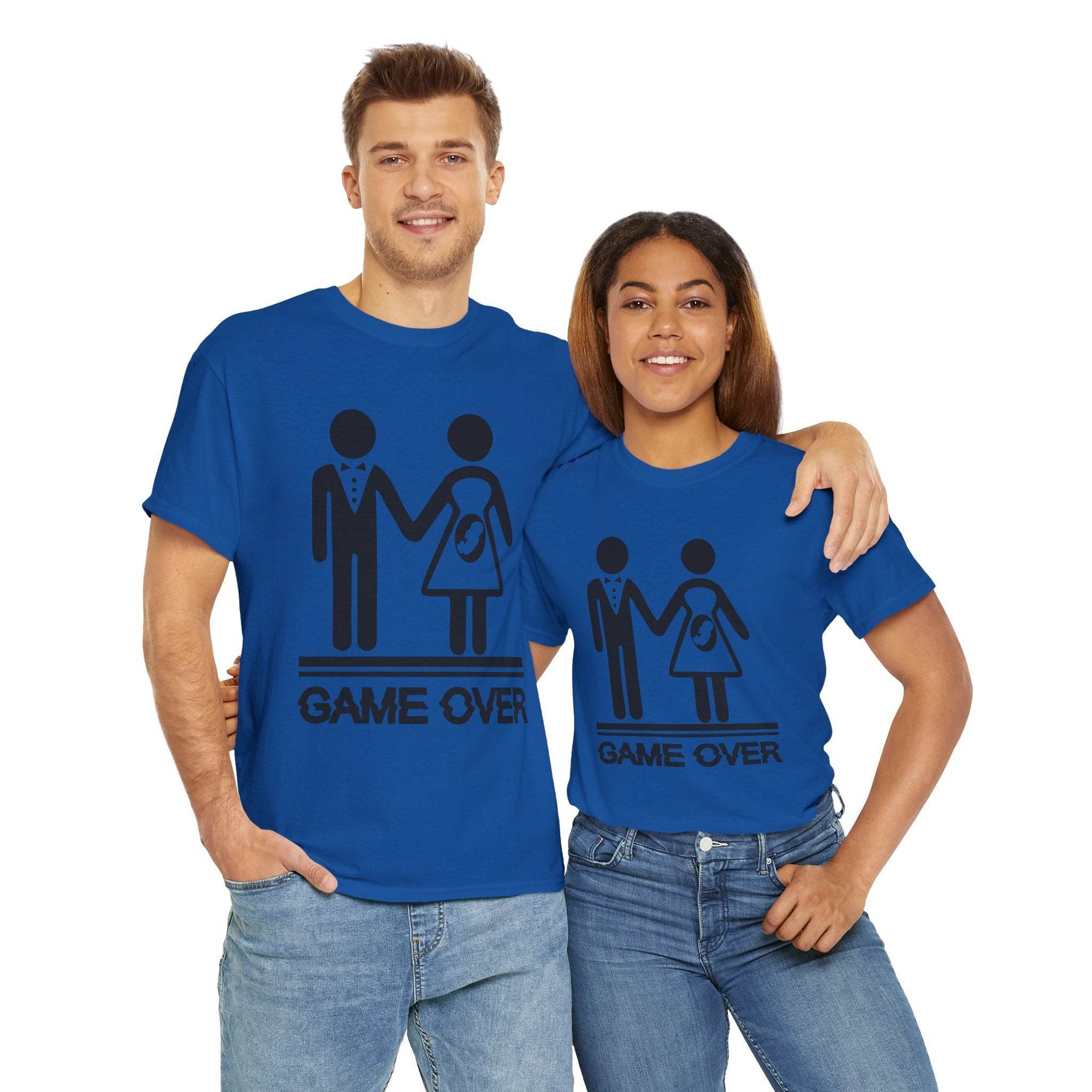 Couple wearing blue Game Over wedding and pregnancy reveal tees with stick-figure family.