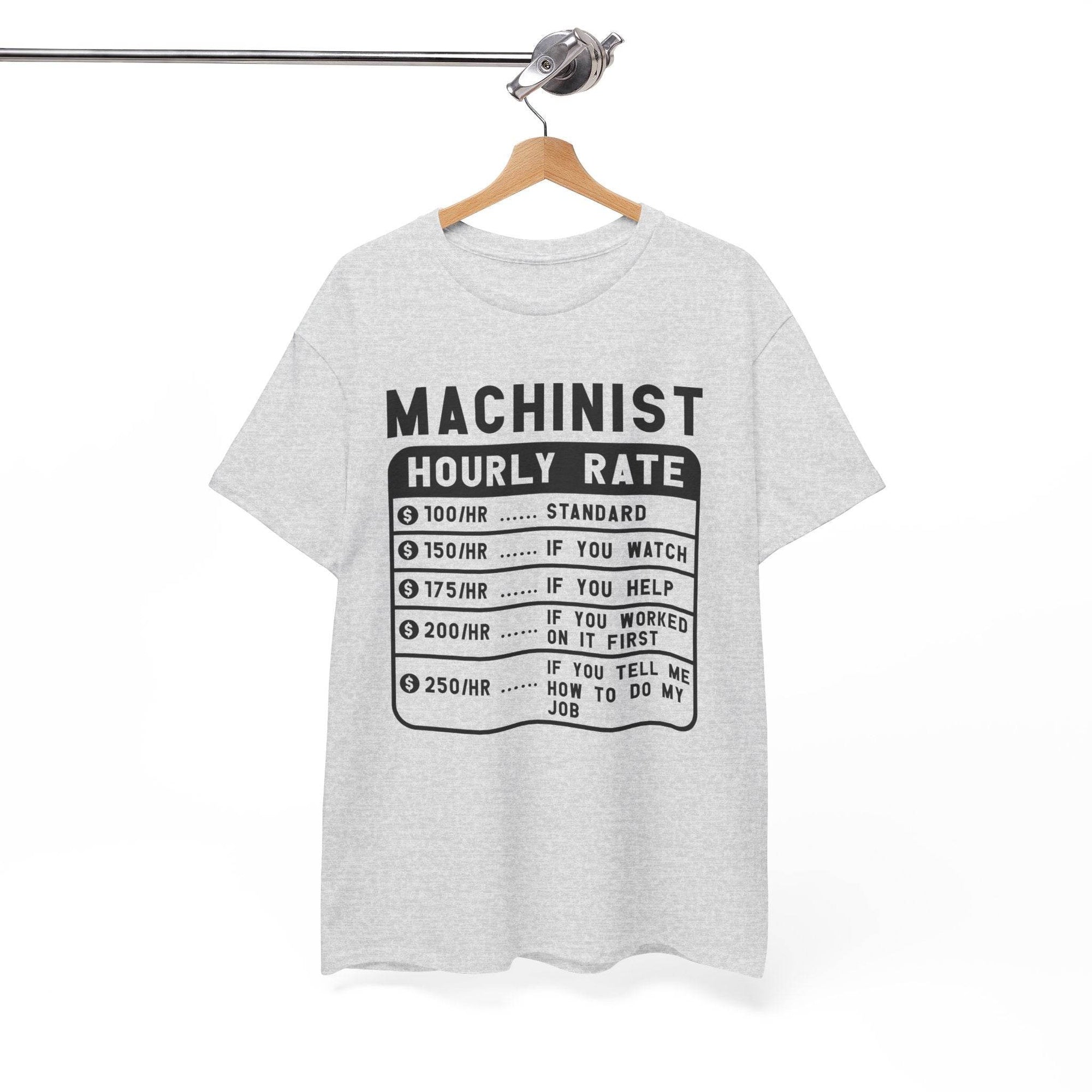 Gray t-shirt with black text on a hanger against a white background