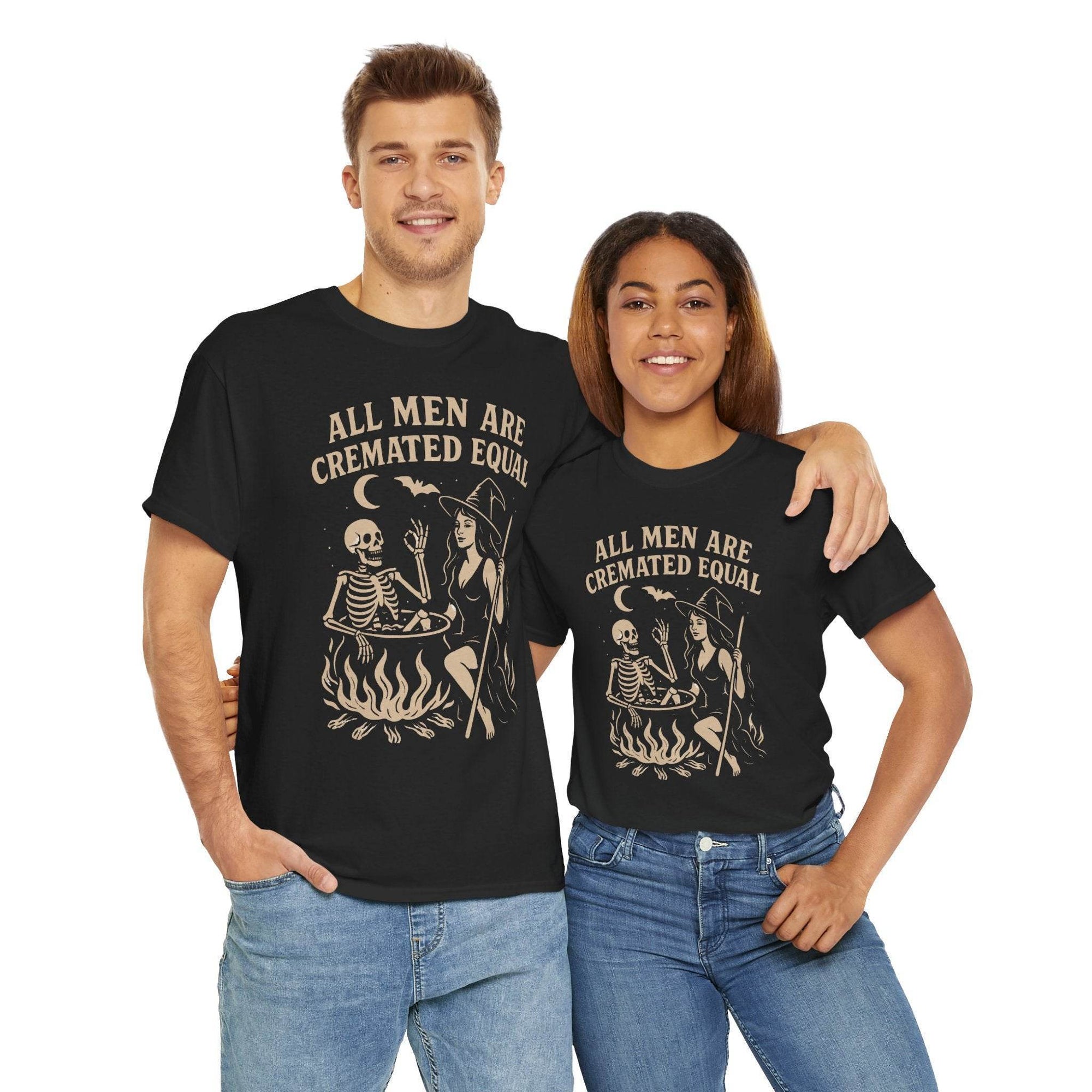 Couple wearing black tees featuring All Men Are Cremated Equal witch cauldron design on Gildan 5000.