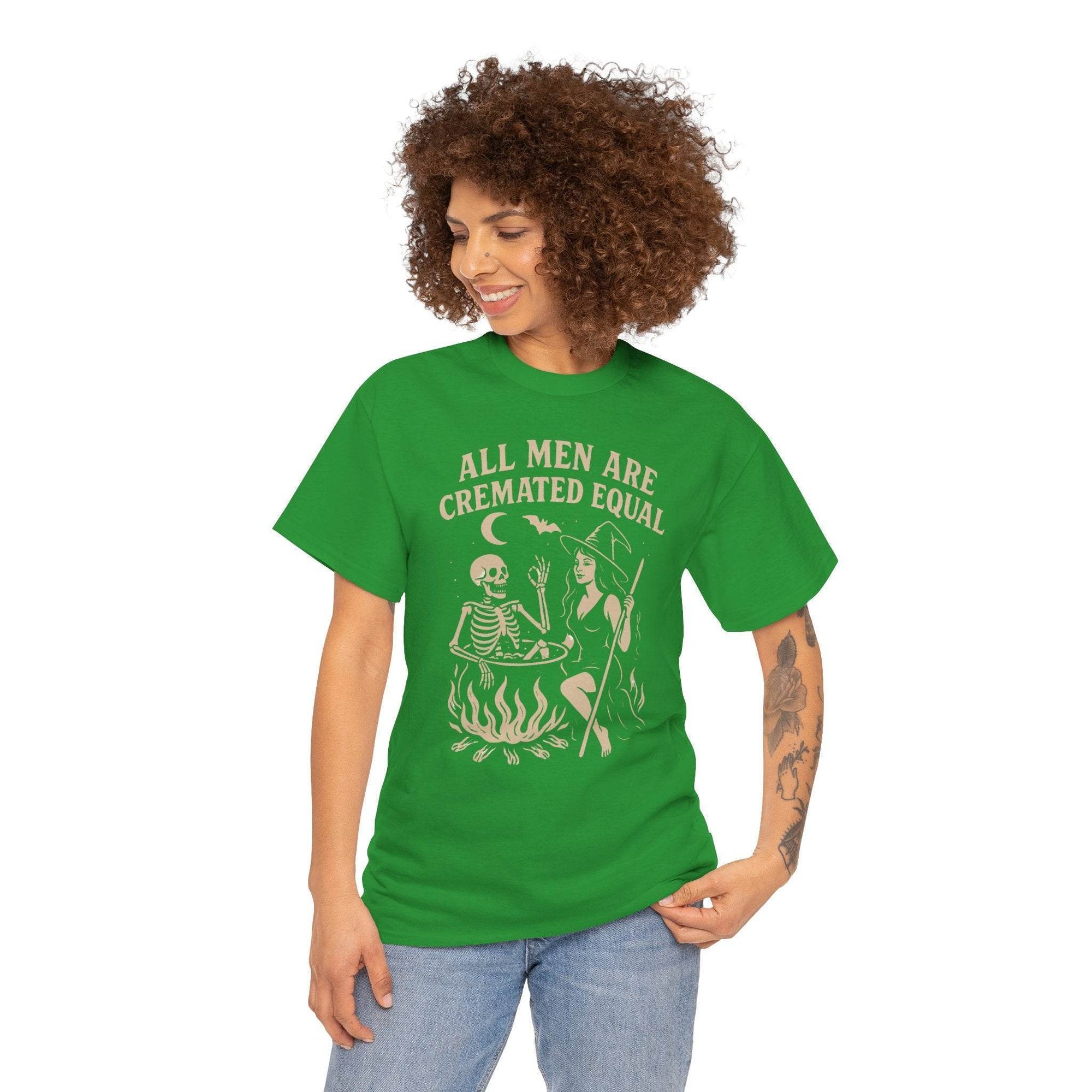 Green Gildan 5000 tee featuring a witch and skeleton by a cauldron with the text All Men Are Cremated Equal.