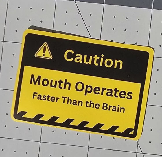 video of sticker yellow caution sign with black "Caution Mouth Operates Faster Than the Brain"
