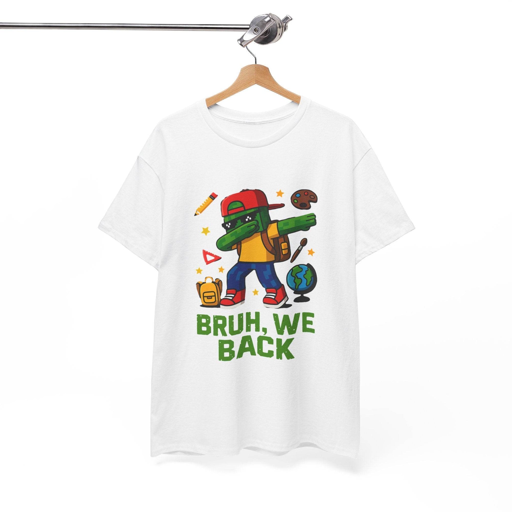White tee featuring a green gamer kid dabbing with backpack, globe, school icons, and BRUH, WE BACK text.
