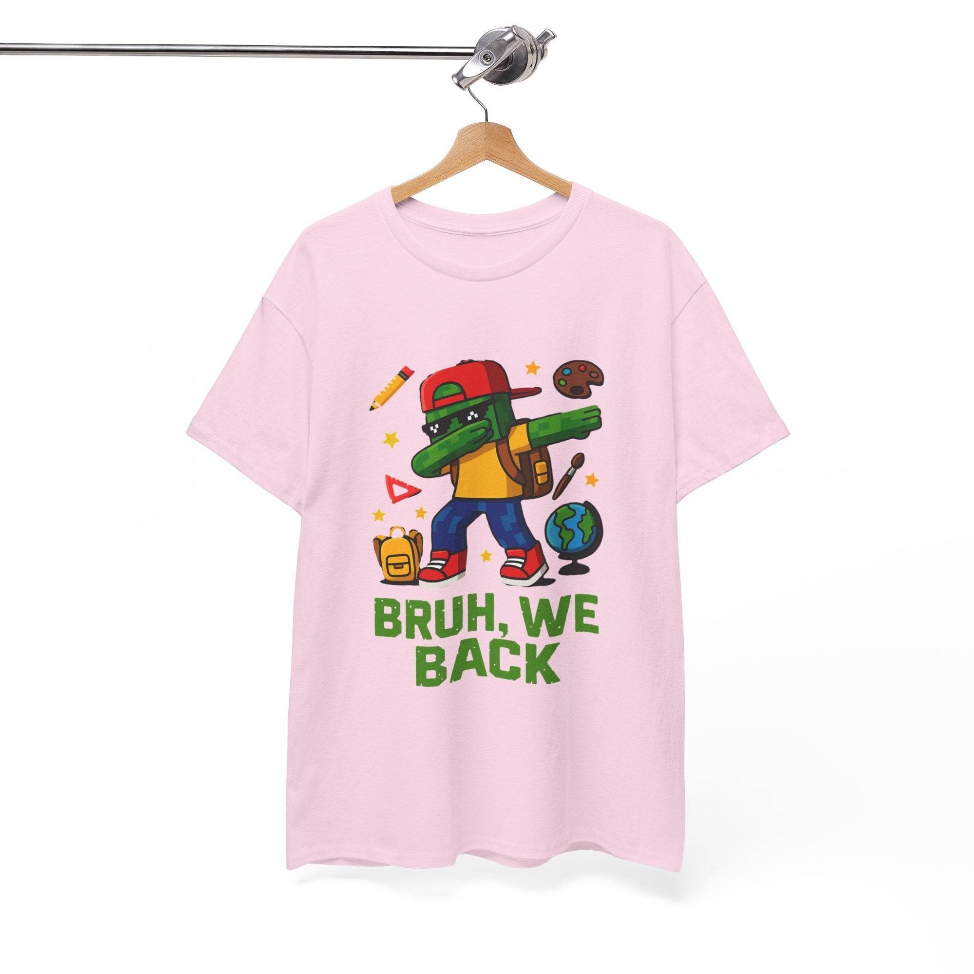 Pink T-shirt with a green gamer kid doing a dab, backpack, globe and school icons, and BRUH, WE BACK text
