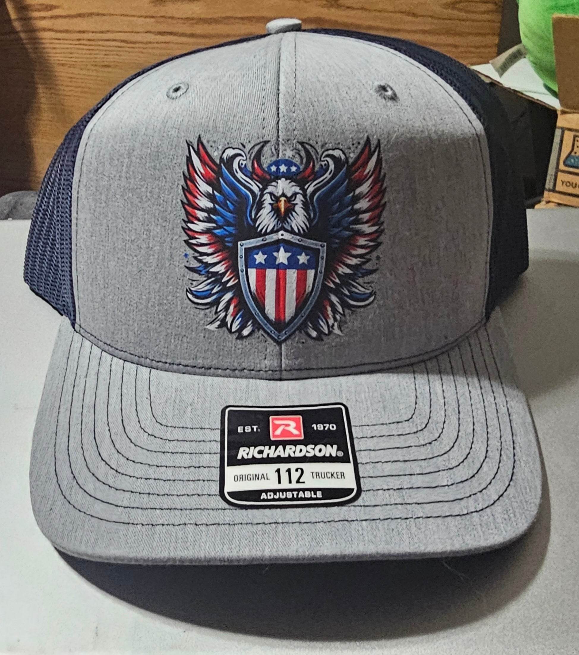Custom Richardson 112 trucker hat with a bold eagle holding a shield emblem in red, white, and blue.